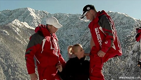 Two Ski Patrol Members Shove Their Way Into The Holes O